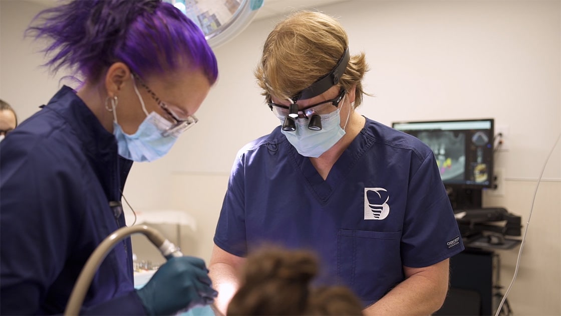 Dentist performing procedure